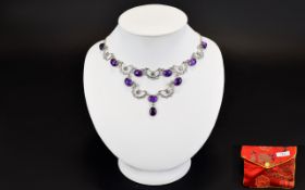 A Silver And Amethyst Necklace Delicate necklace on fine silver chain with 10 amethyst cabochons