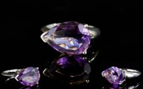 A Sterling Silver And Amethyst Teardrop Ring East west design with large central faceted teardrop