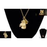 A Good Quality and Well Made Pair of 9ct Gold Charms In The Form of Articulated Boxing Gloves,