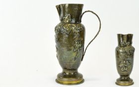 Trench Art Jug An antique brass jug fashioned from shell casing with footed bottom and attractive