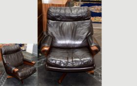 A Mid Century Scandinavian Swivel Chair 1950's Low arm chair upholstered in deep brown nappa