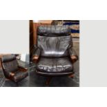 A Mid Century Scandinavian Swivel Chair 1950's Low arm chair upholstered in deep brown nappa