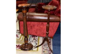 A Pair Of Antique Hall Stands Two tall plant stands in dark wood,