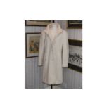 Cream Wool Blend Ladies Mid Length Coat By BHS features stand collar, concealed side seam pockets,