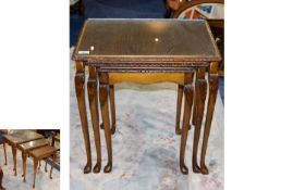 Nest Of Tables with a carved edge and cabriole legs with a glass top. 21 inches in height and 15