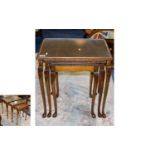 Nest Of Tables with a carved edge and cabriole legs with a glass top. 21 inches in height and 15