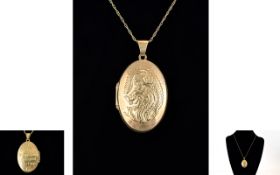 A 9ct Gold - Hinged Oval Shaped Dragon Charm Locket with Attached 9ct Gold Chain.