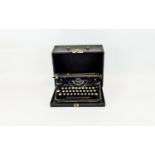 A Vintage Underwood Portable Typewriter Cased typewriter in traditional black lacquer finish with