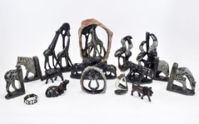 A Collection of African Safari Figures including zebra and giraffe book ends, various figure groups,