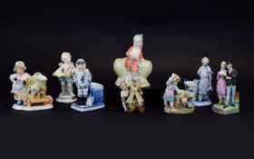 A Collection of Late 19th Century Hand Painted Ceramic Figures and Figural Match Holders / Strikers.