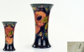 William Moorcroft Trumpet Shaped Vase - Pomegranates and Berries Design. c.1920's.