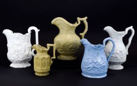 A Fine Collection of Early to Mid 19th Century Relief Moulded Pewter Lidded Jugs ( 5 ) Five In