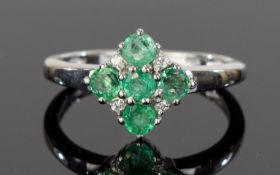 Emerald Cluster Ring, five round cut emeralds with four natural white zircon, totalling .75ct, set