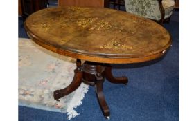 Walnut Tile Top Table, Oval Top with Inlay, Quadrafoil Base on Ceramic Castors. 46 Inches wide &