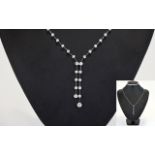 18ct White Gold Elegant Set Diamond Domino Necklet.