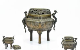 A Reproduction Oriental Brass Censer Of rhombic form with applied cast Phoenix decoration to sides