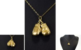 Pair of 9ct Gold Charms In The Form of Boxing Gloves - Attached to a 9ct Gold Chain.