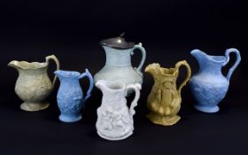 A Good Collection of Late 18th Century to Mid 19th Century Moulded Jugs, Decorated In High Relief.