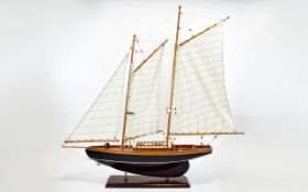 Large Model of A Sailing Boat raised on a rectangular wooden plinth.
