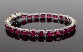 Ruby Tennis Bracelet, 28cts of oval cut, rich red rubies, set over 26 stones, making each one over
