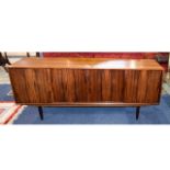 Rosewood Sideboard. Four Sliding Doors Enclosing Three Shelves And Storage.