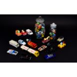 A Collection Of Playworn Cars And A Variety Of Glass Marbles Comprising two traditional sweet jars