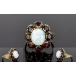 Impressive 9ct Gold Set Opal and Garnet Cluster Ring. The Oval Shaped Opal Surrounded by 8 Garnets.