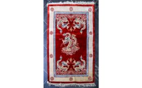 Chinese Style Red and Beige Rug with tasseled edging.