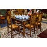 Continental Dining Set comprising extending table and chairs. The chair backs with oak carved