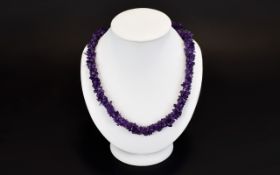 Amethyst Necklace A Two strand rope style necklace comprising multiple Amethyst chips with silver