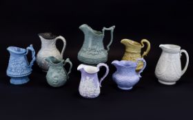 A Very Good Collection of Mid 19th Century Moulded Jugs Decorated In High Relief ( 8 ) Jugs In
