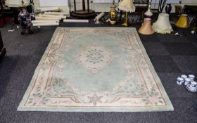 A Large Oriental Style Wool Blend Rug Re