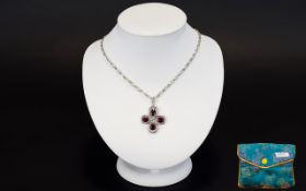 A Silver Ruby And Diamond Pendant Neckla