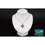 A Silver Ruby And Diamond Pendant Neckla