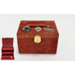 A Suede Jewellery Box And Three Brooches