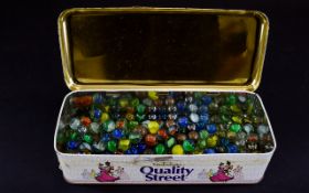 Tin of old vintage marbles