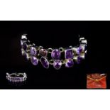 A Contemporary Silver And Amethyst Statement Bracelet Chunky silver bracelet set with 24 large