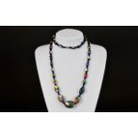 A Long Millefiori Bead Necklace Long handmade beaded necklace with small blue glass bead stations