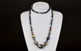 A Long Millefiori Bead Necklace Long handmade beaded necklace with small blue glass bead stations