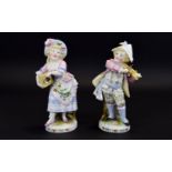 Conta and Boehme Pair of Child Musician Matchbox Holder Figures, both boy and girl dressed in a