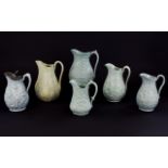 Collection of Six Floral Theme Moulded Jugs, one, Cork, Edge and Malkin; date lozenge for 1861,