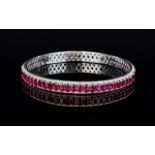 Ruby Circular Bangle, 21cts of oval cut rubies, closely set in a full circle,