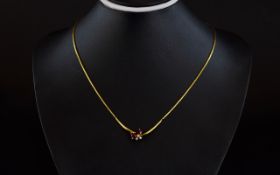 18ct Gold Necklace with 2 Pear Shaped Rubies & 3 Diamonds set on a twist drop with insurance