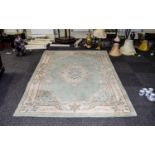 A Large Oriental Style Wool Blend Rug Rectangular rug with central floral cartouche and cream and