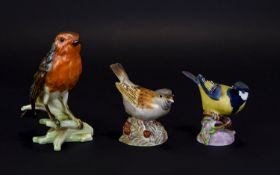 Three Pottery Bird Figures Comprising Royal Worcester Sparrow & Great Tit And A Goebel Robin