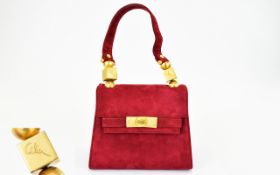 A Vintage Miniature Suede Box Bag Small top handle structured bag in claret suede finished with