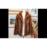 Medium Brown Short Mink Jacket with rever collar and slit pockets. Fully lined.