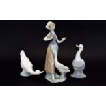 Lladro Figure ' Girl with Duck ' Model No 1052. Issued 1991 - 1993. Height 9.