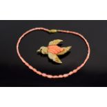 A Vintage Coral Set Statement Brooch And Coral Bead Necklace Large gold tone brooch in the form of
