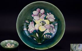 William Moorcroft Signed Large Footed Bowl ' Freesia ' Design on Green Ground. Signed In Green to